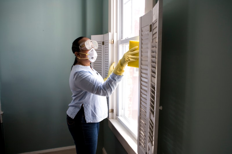 Professional cleaner working efficiently in a property